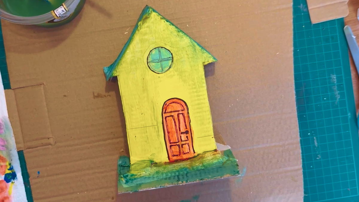 A cardboard house craft by The Catbears